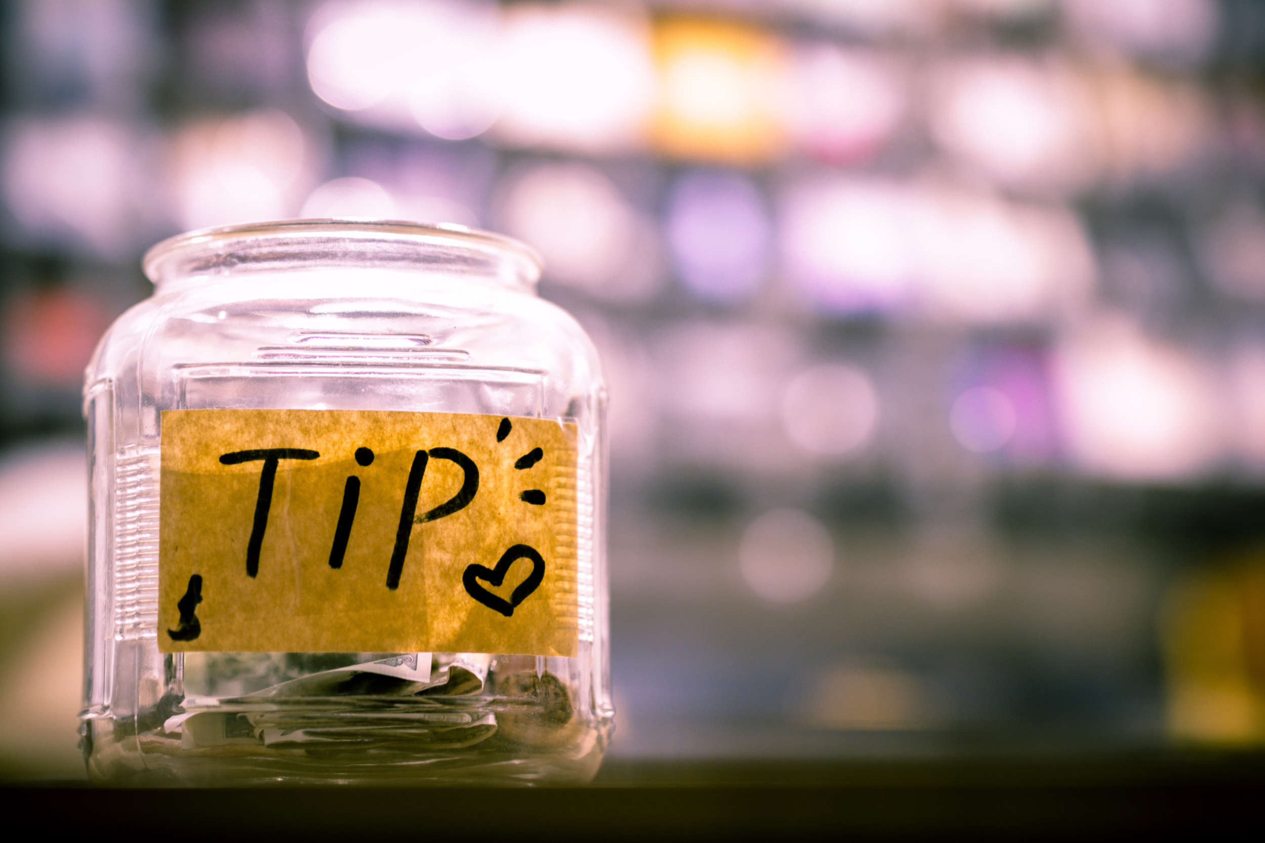 tip jar with money showing creators alternatives to patreon